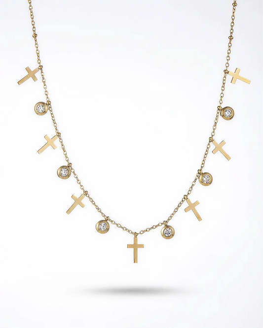 Gold necklace with crosses and small diamonds on a white background