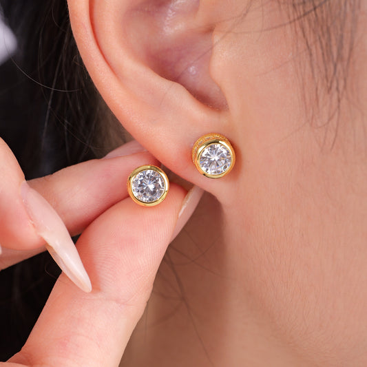 2.5 carat round CZ solitaire stud earrings in yellow gold over 925 sterling silver bezel settings