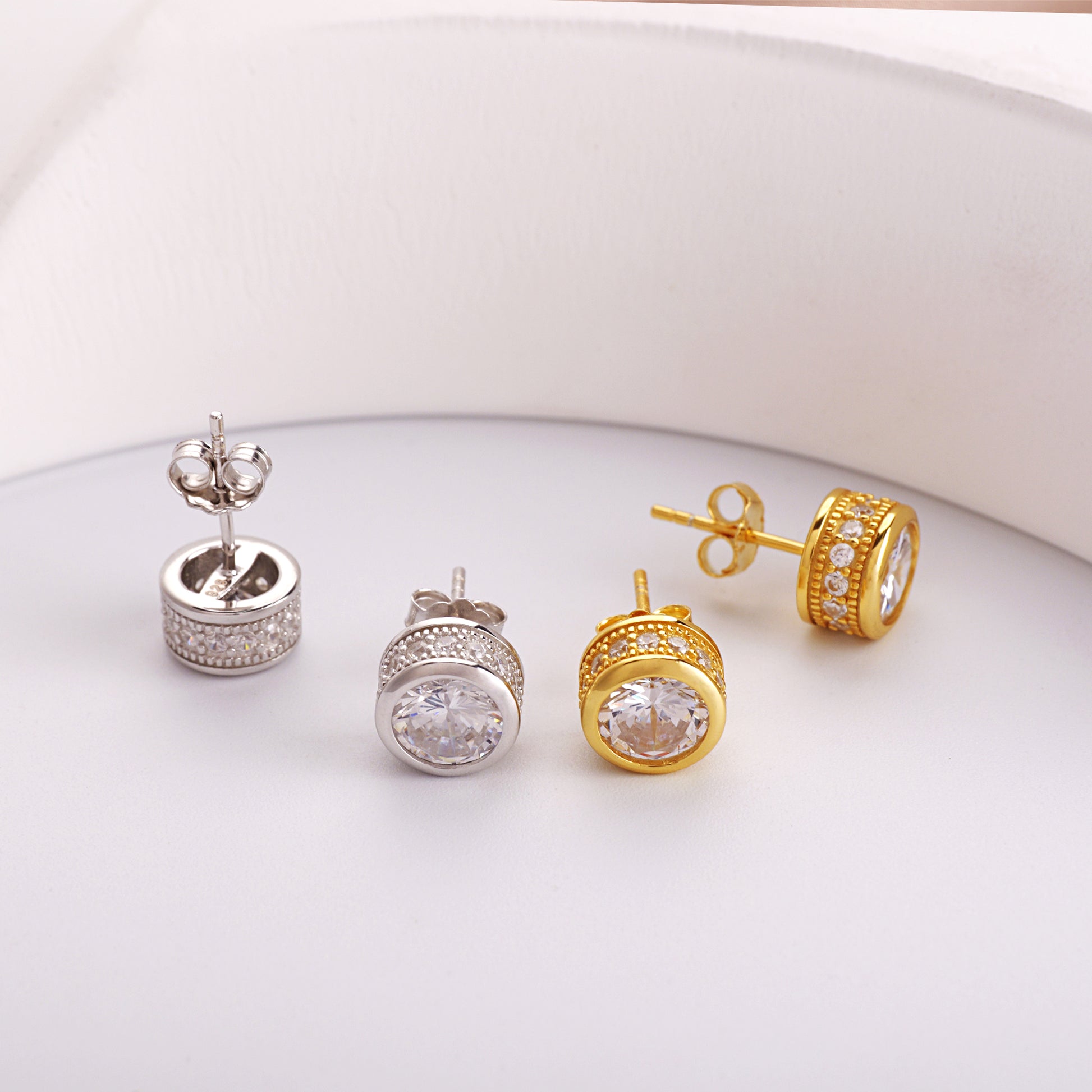 2.5 carat round CZ solitaire stud earrings in yellow gold over 925 sterling silver bezel settings
