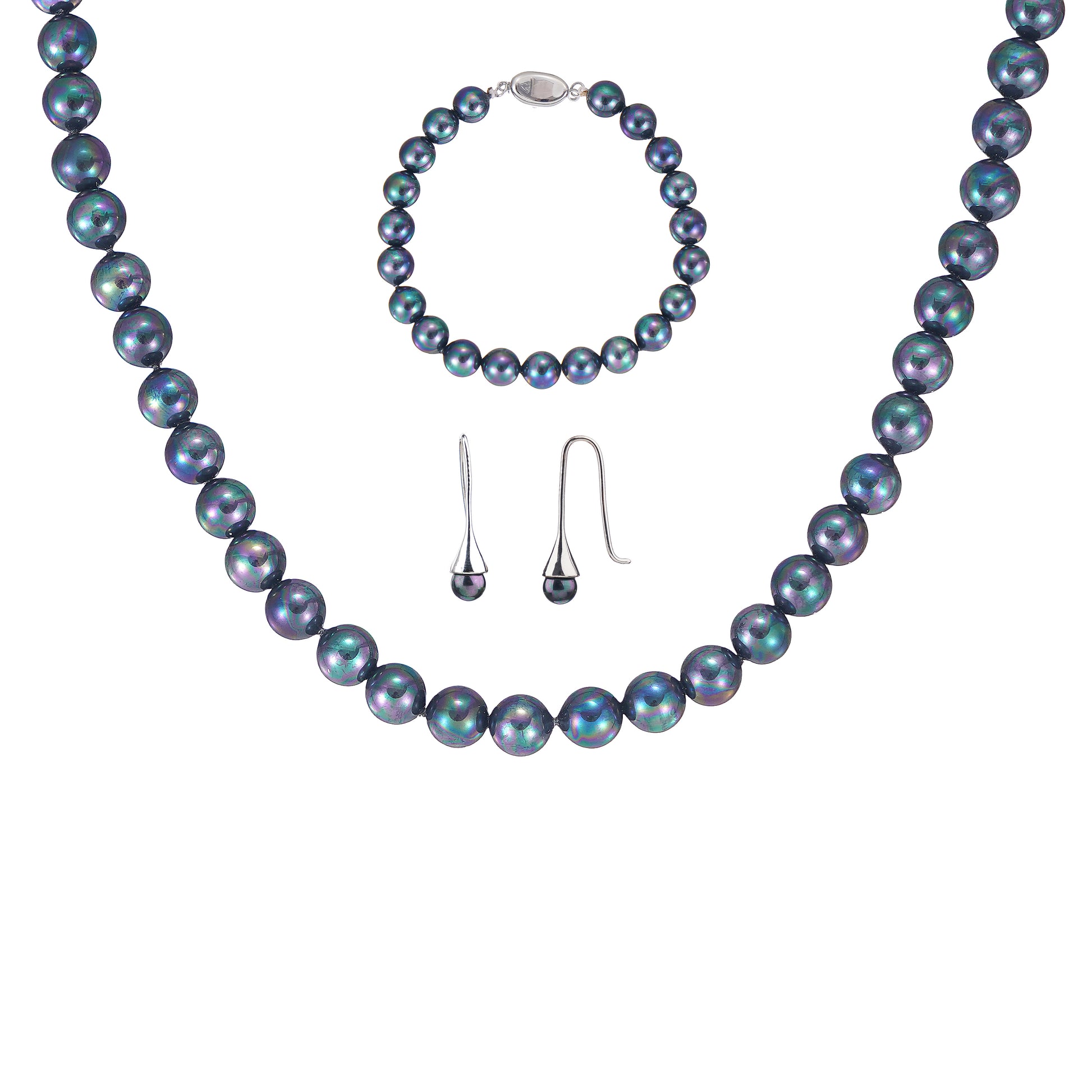 3-piece black peacock shell pearl jewelry set featuring necklace, bracelet, and earrings on a jewelry bus