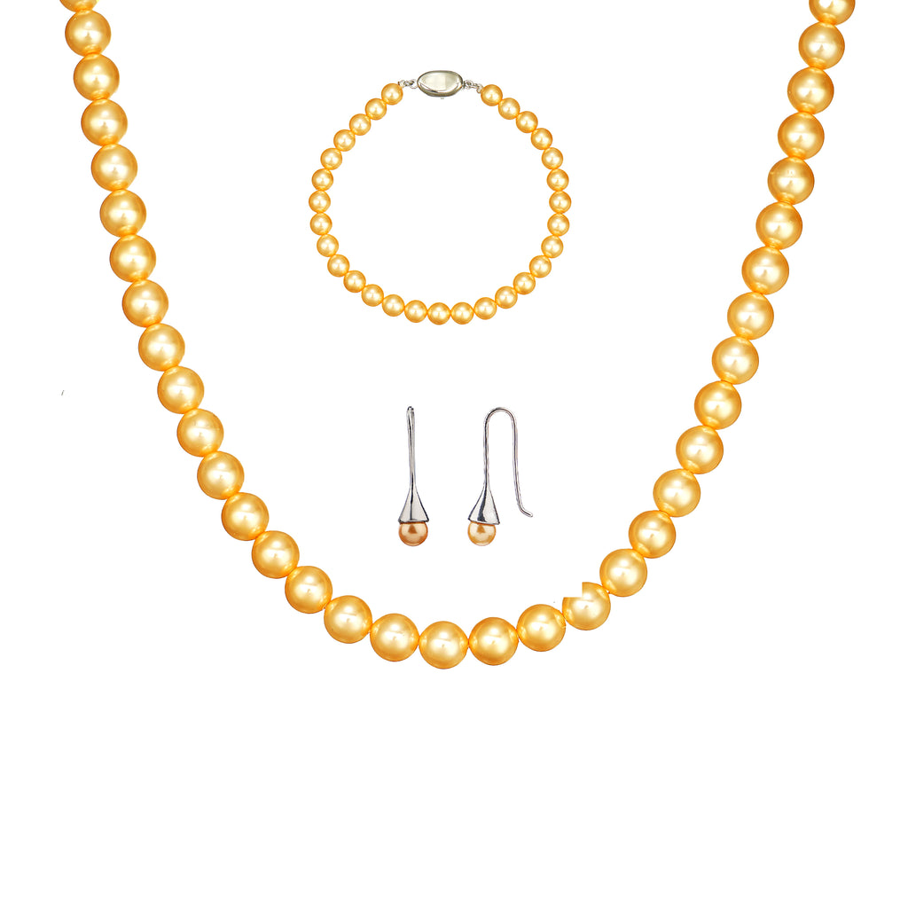 3-piece golden shell pearl jewelry set featuring 6mm round necklace, bracelet, and stud earrings