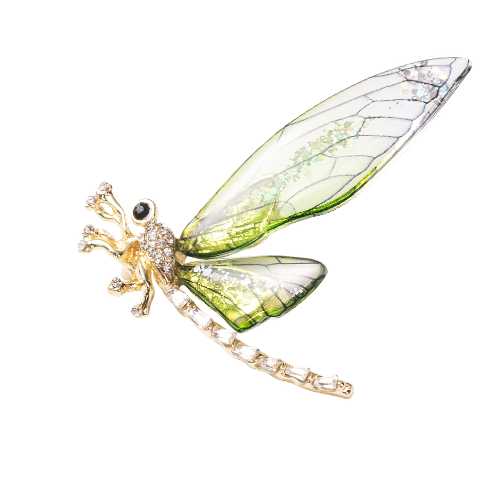A brooch pin jewelry featuring a yellow gold over brass base with a dragonfly design, encrusted with sparkling crystals.