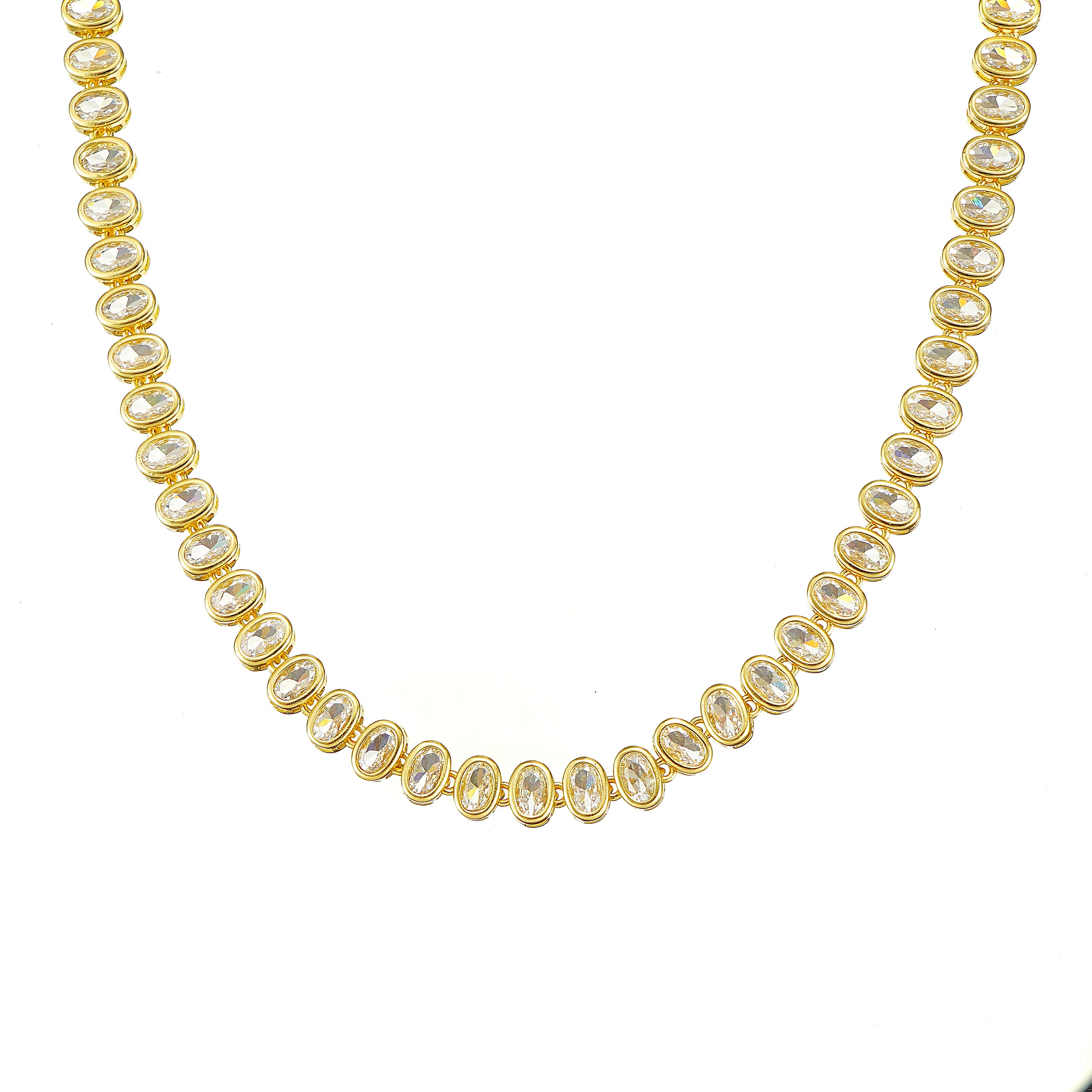 A gold-plated tennis necklace with oval-cut sparkling simulated diamond CZ.