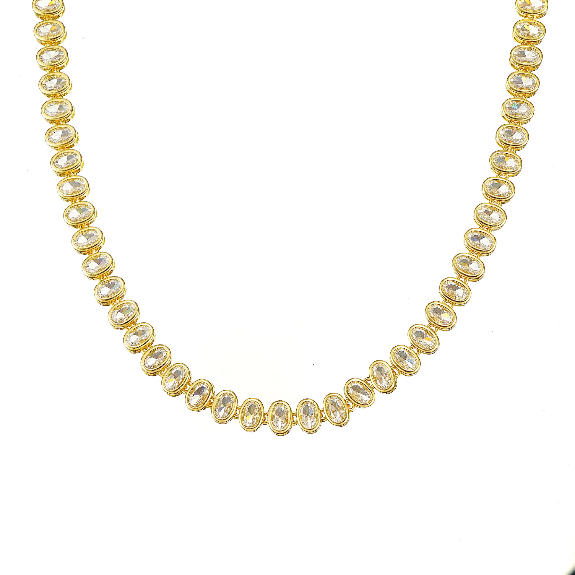 A gold-plated tennis necklace with oval-cut sparkling simulated diamond CZ.
