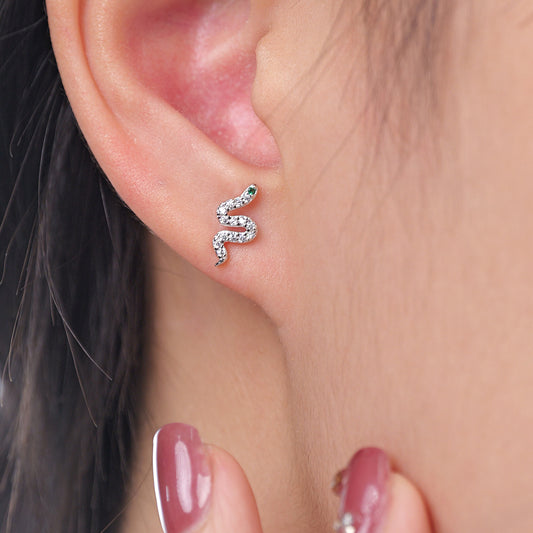 A pair of sterling silver earrings featuring a delicate snake motif with sparkling CZ accents.