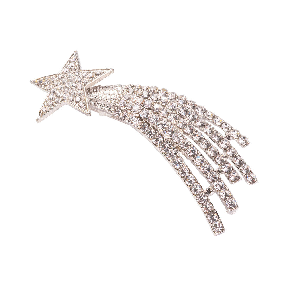 A silver-colored brooch in the shape of a shooting star adorned with sparkling crystals.