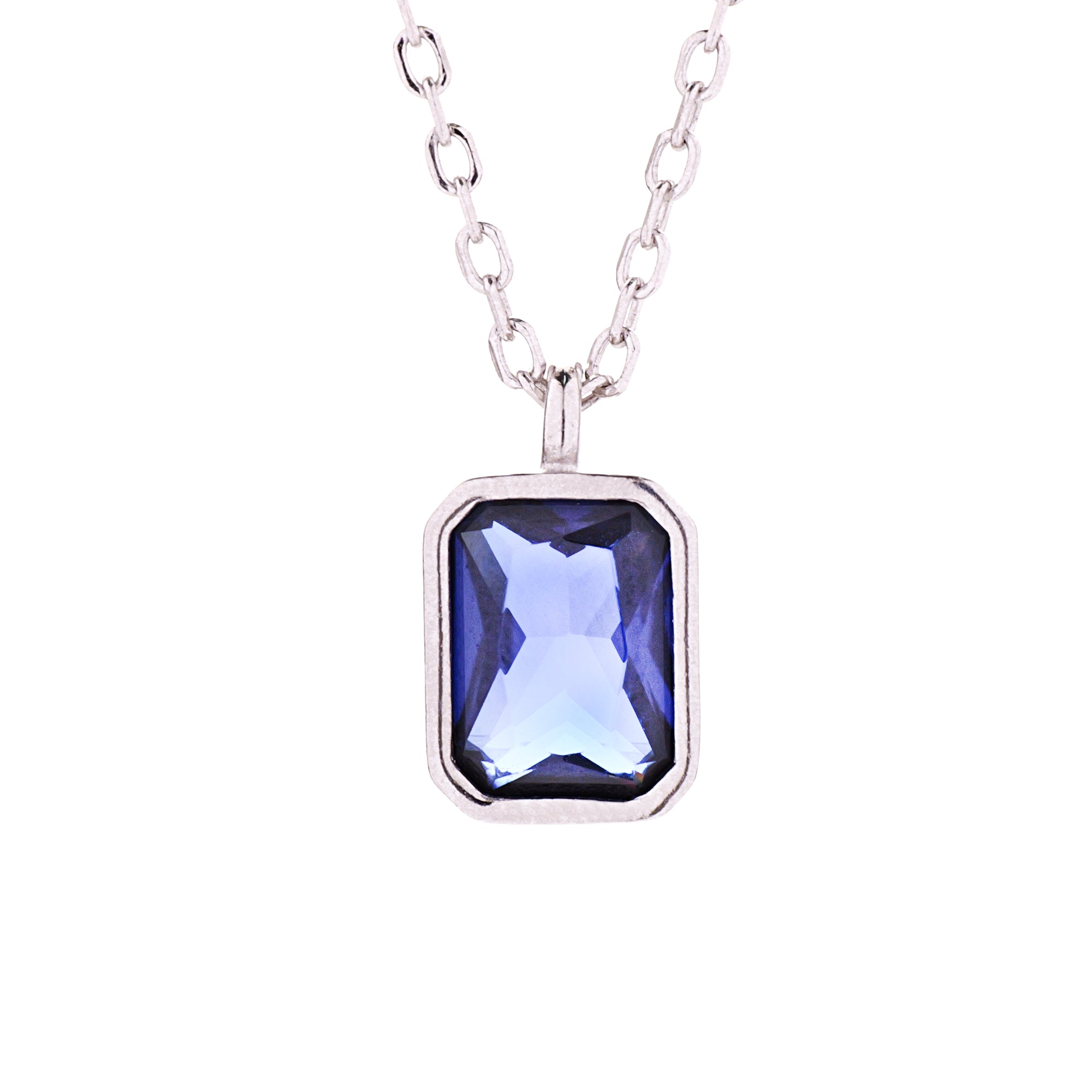 A sterling silver bezel pendant necklace with an octagon-cut blue CZ stone, displayed on a chain.