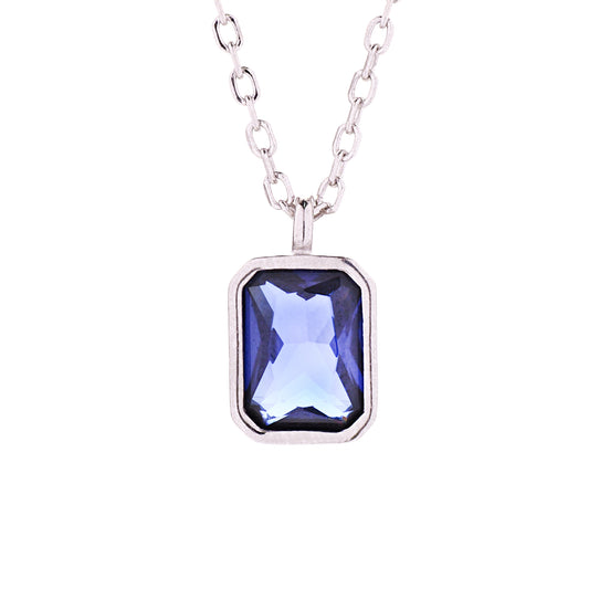 A sterling silver bezel pendant necklace with an octagon-cut blue CZ stone, displayed on a chain.