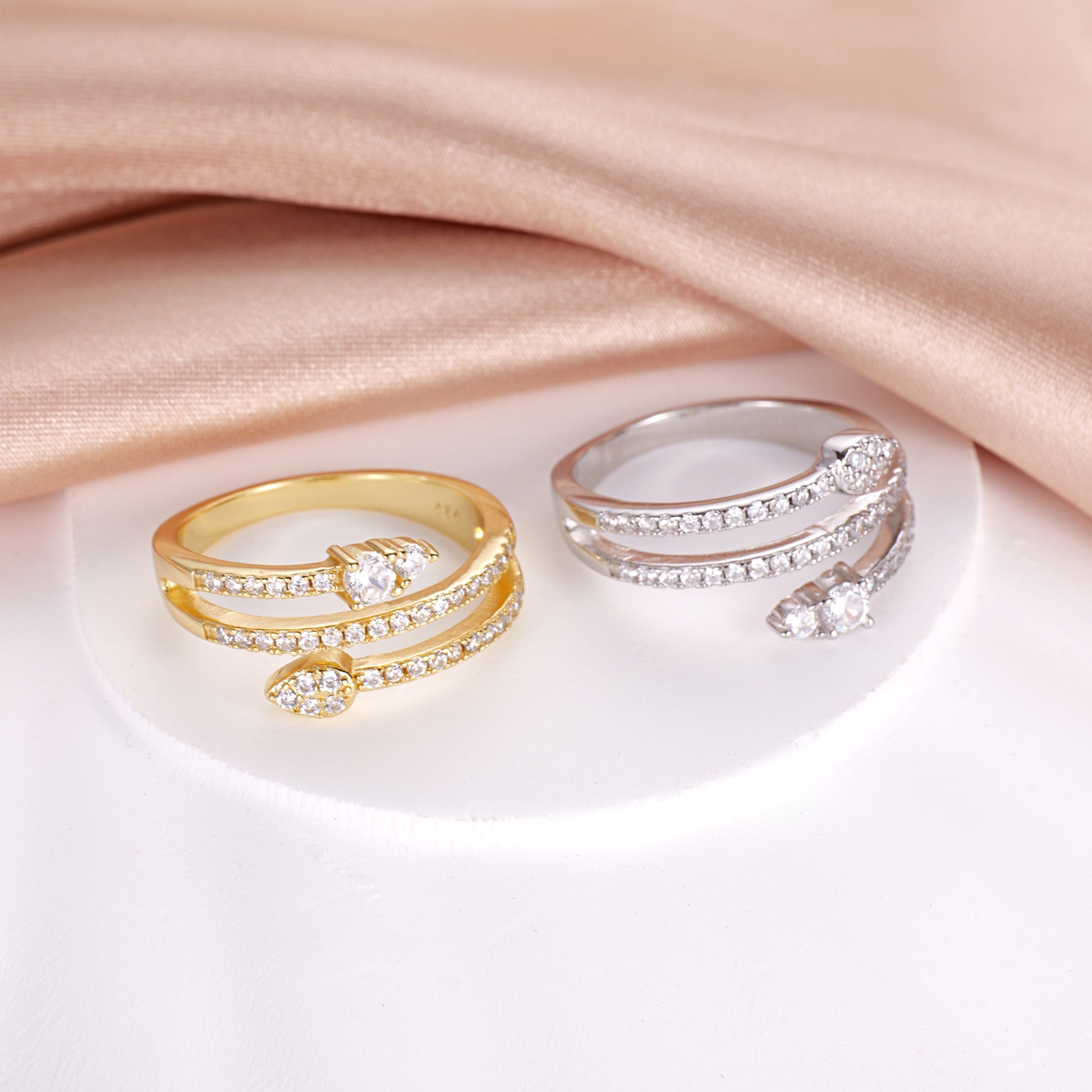 A sterling silver bypass ring with a snake design and sparkling cubic zirconia accents.