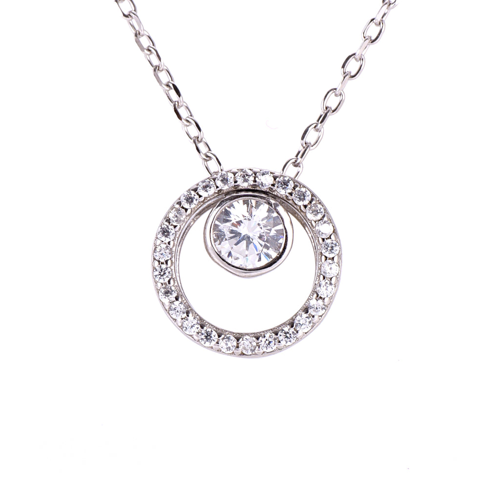 A sterling silver necklace featuring a dainty circle pendant with a round CZ stone, displaying a polished and elegant finish.