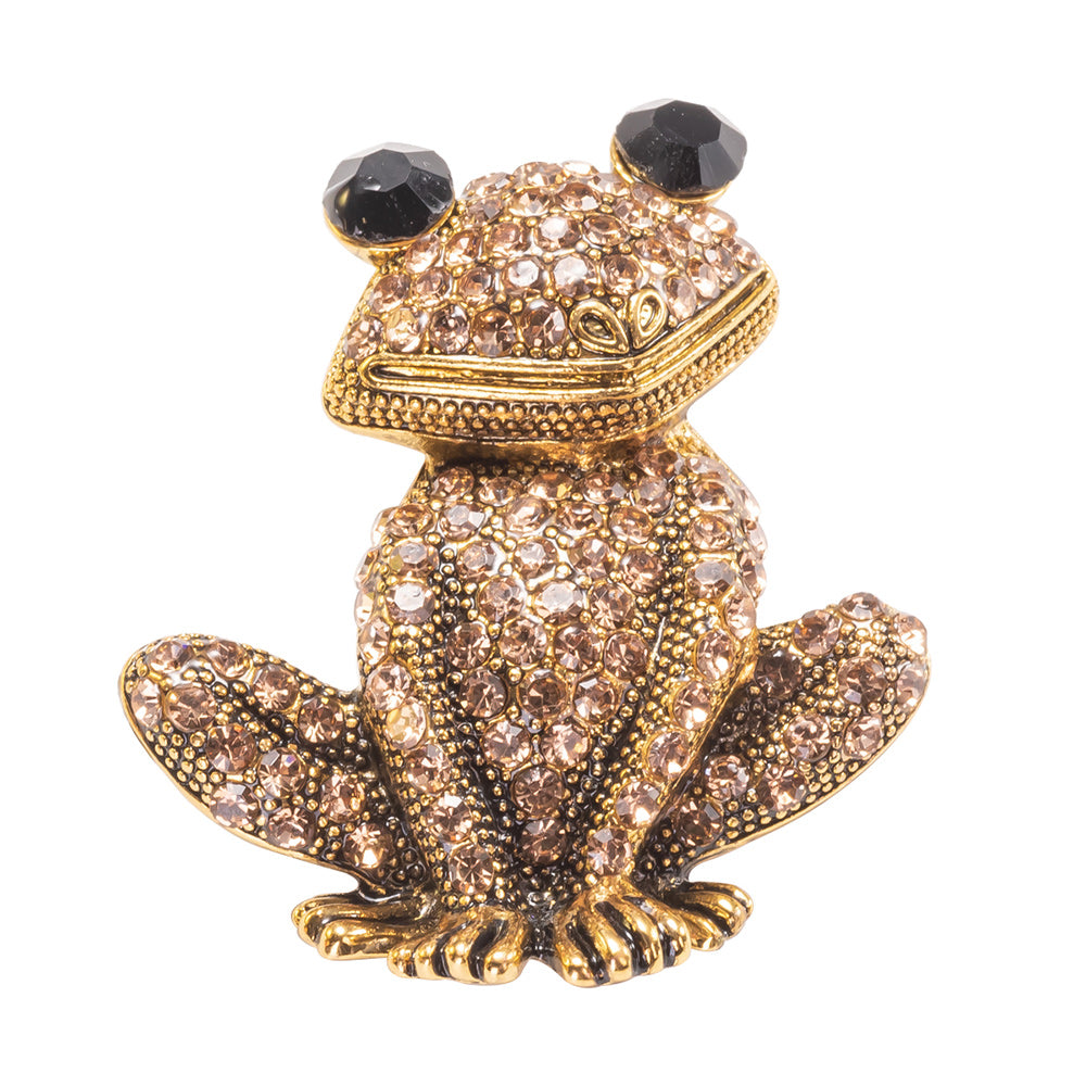 A yellow gold over brass brooch pin featuring a sparkling, champagne crystal-encrusted frog design.