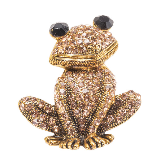 A yellow gold over brass brooch pin featuring a sparkling, champagne crystal-encrusted frog design.