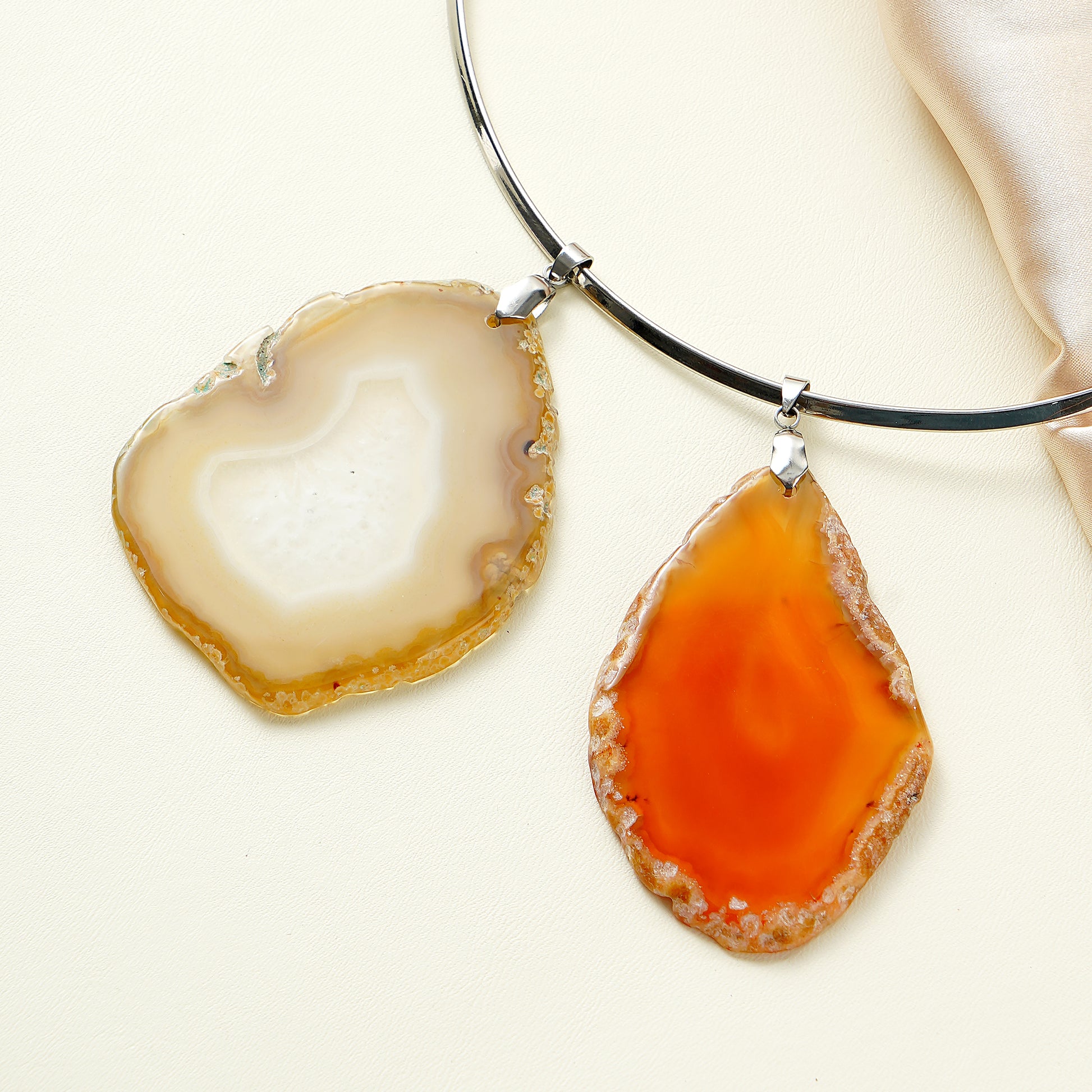 Two agate pendants on a white background