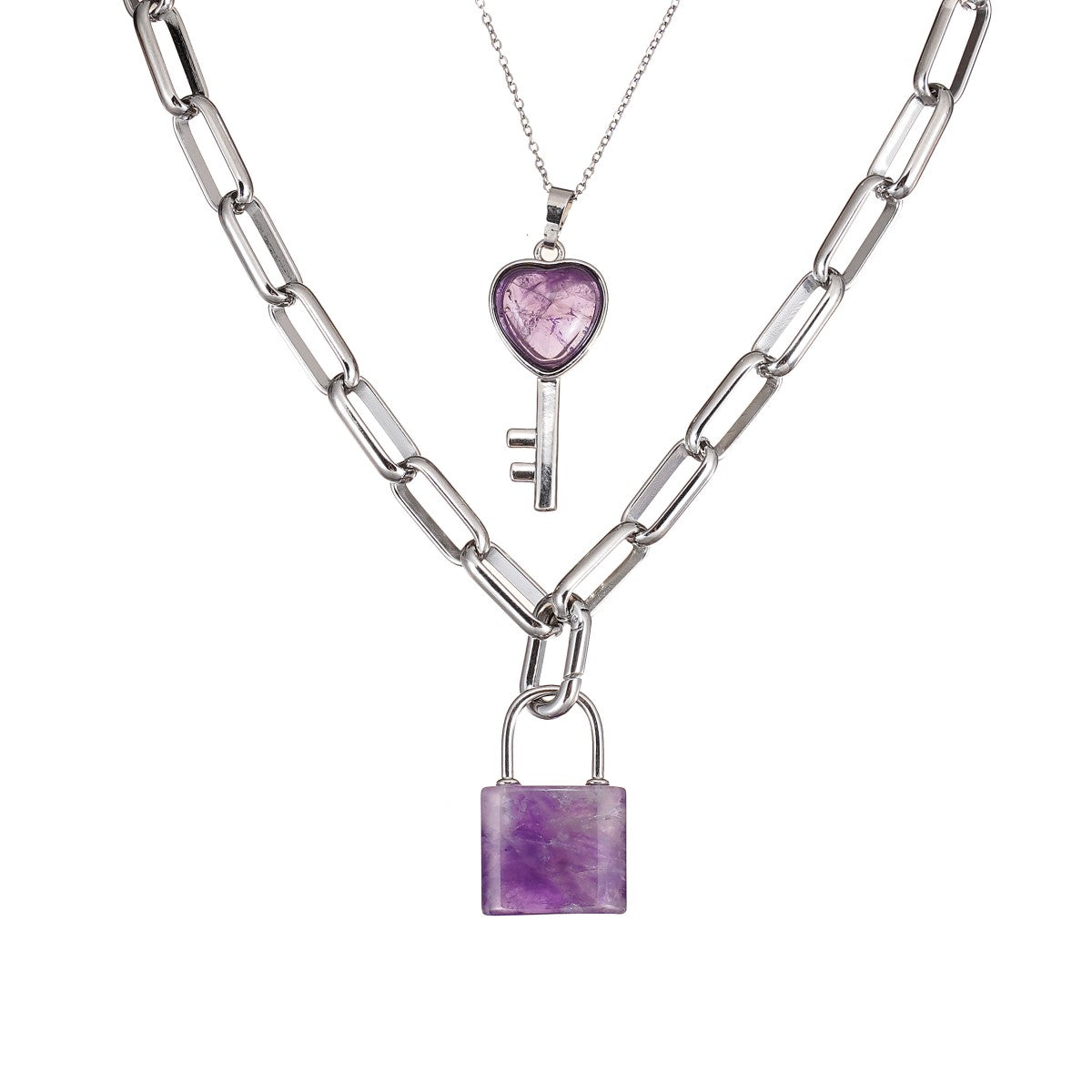 Two silver necklaces with Amethyst heart and lock pendants on a white background