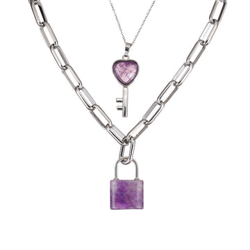 Two silver necklaces with Amethyst heart and lock pendants on a white background
