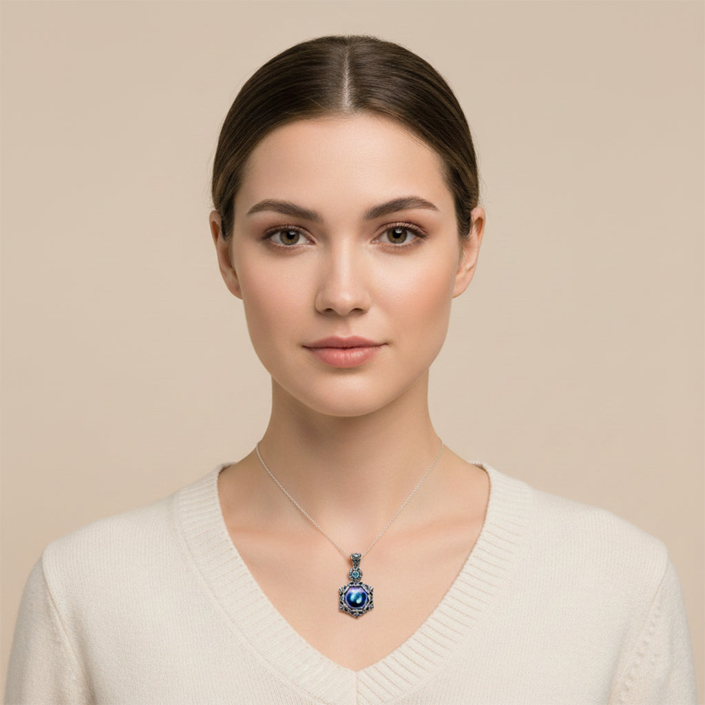 Enchanting Bali Handmade Peacock Mabe Pearl and Sky Blue Topaz pendant in Sterling Silver