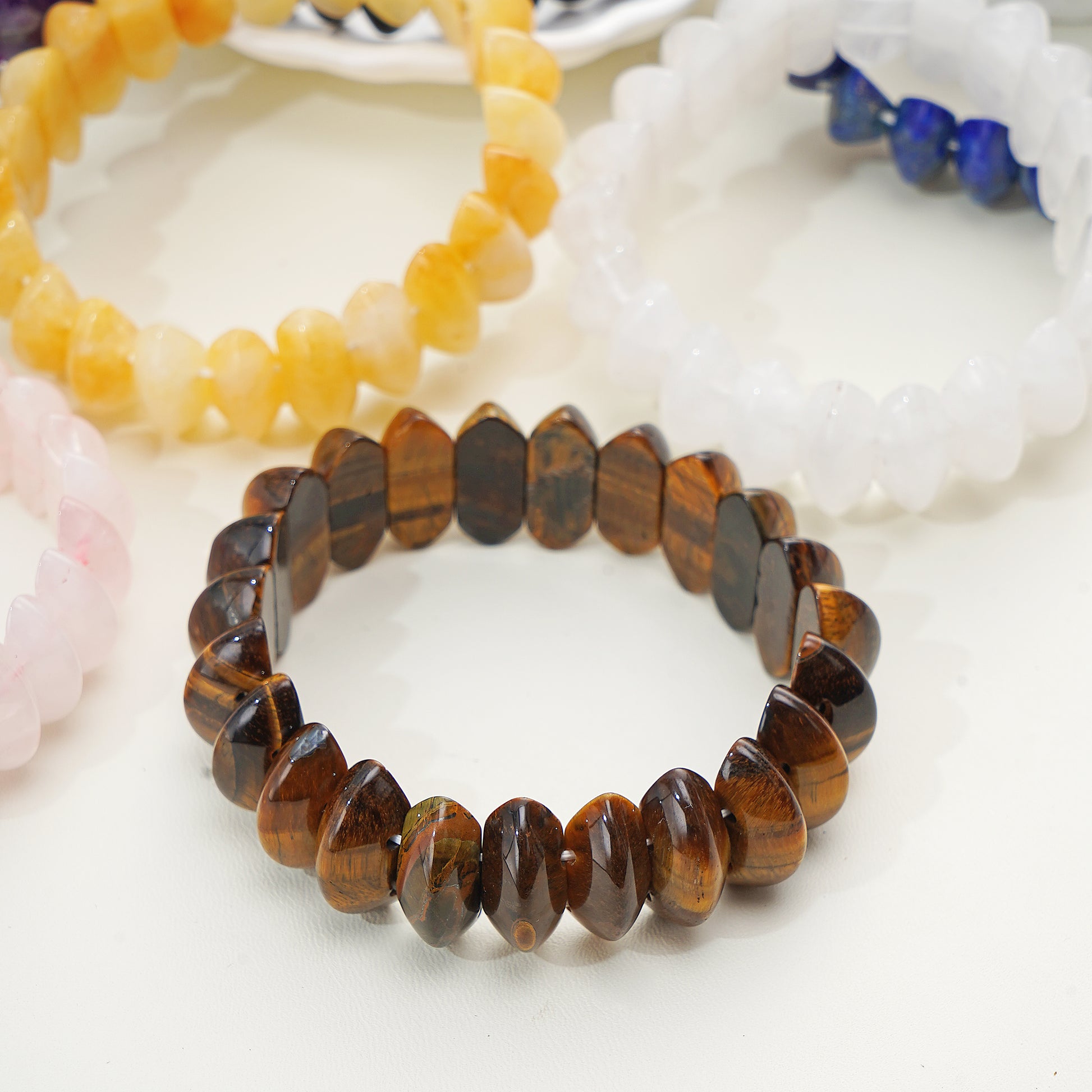 Beaded bracelets on a white surface