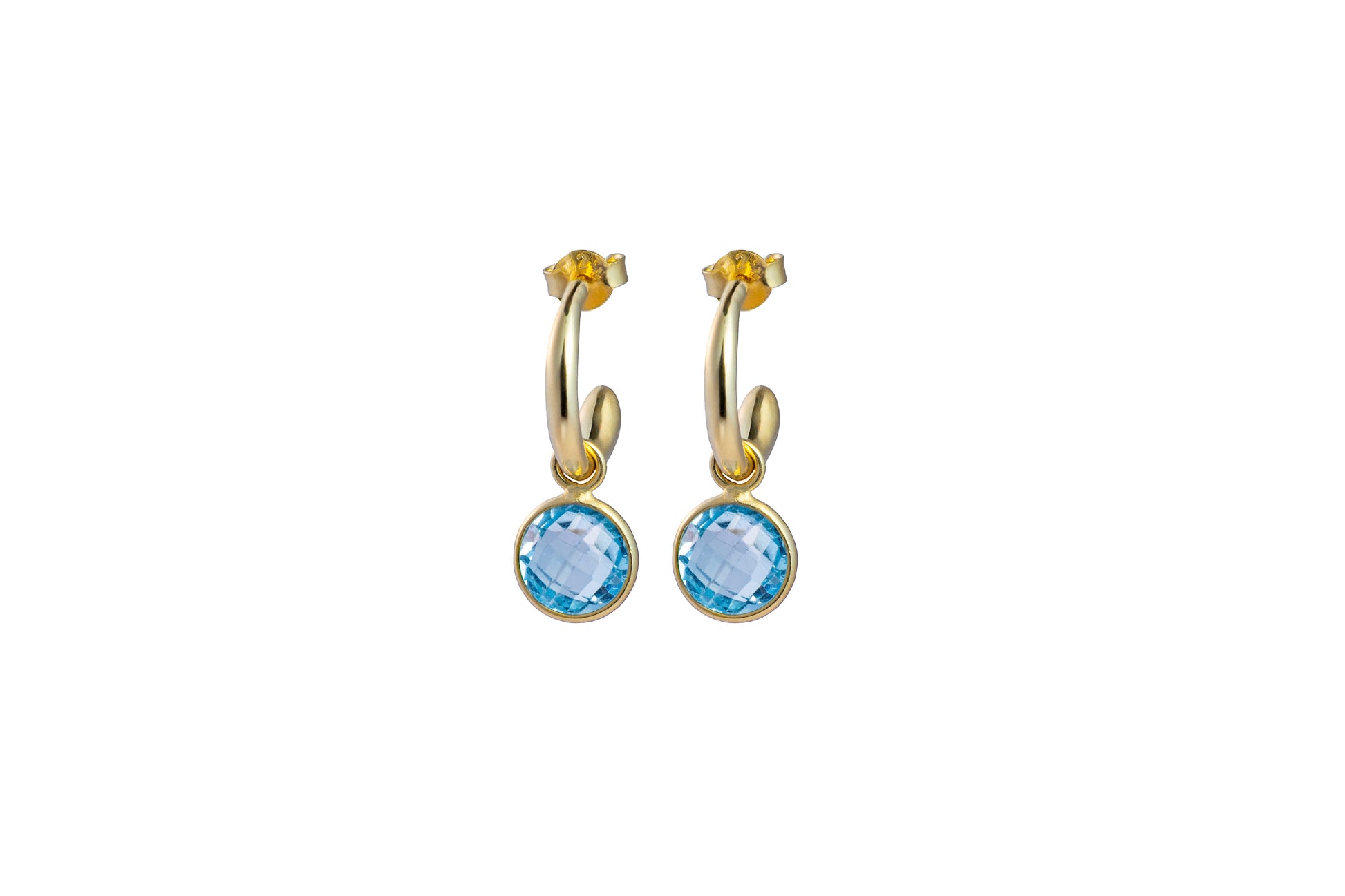 Gold hoop earrings with blue Topaz gemstones on a white background