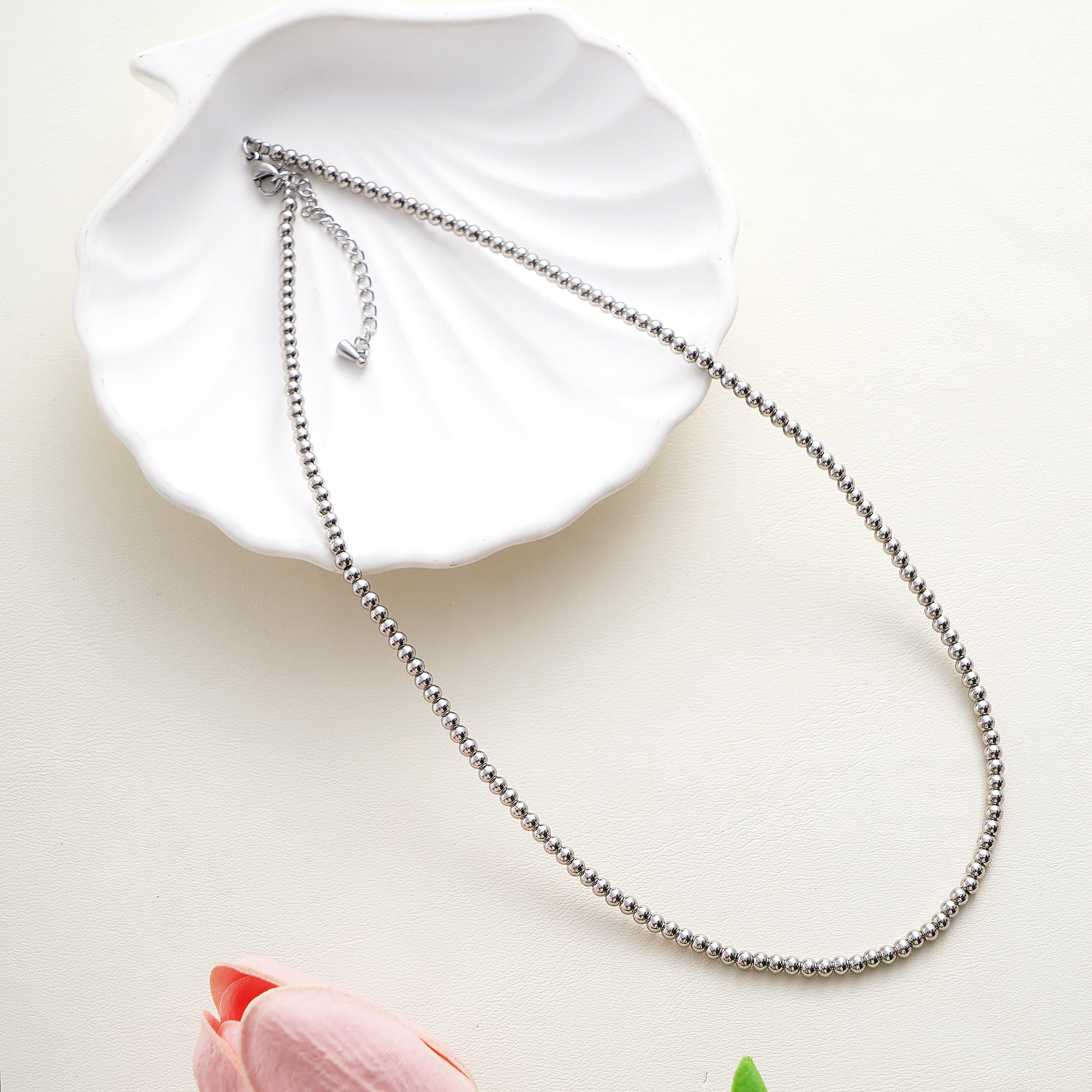 Close-up of the high-polish 3mm steel beads and the adjustable lobster clasp