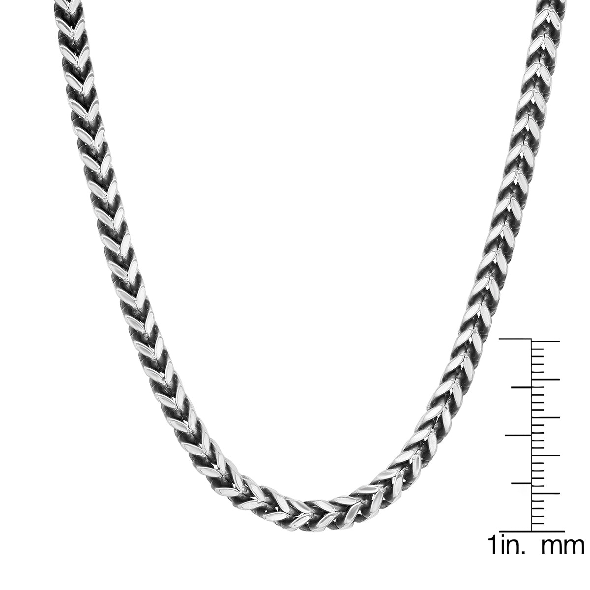 Close-up of the interlocking wheat links showing the intricate braided Spiga texture