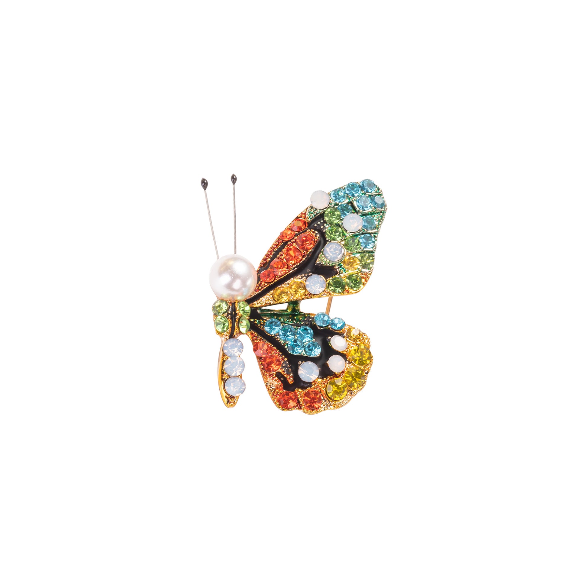 Colorful butterfly-shaped brooch with gemstones on a white background