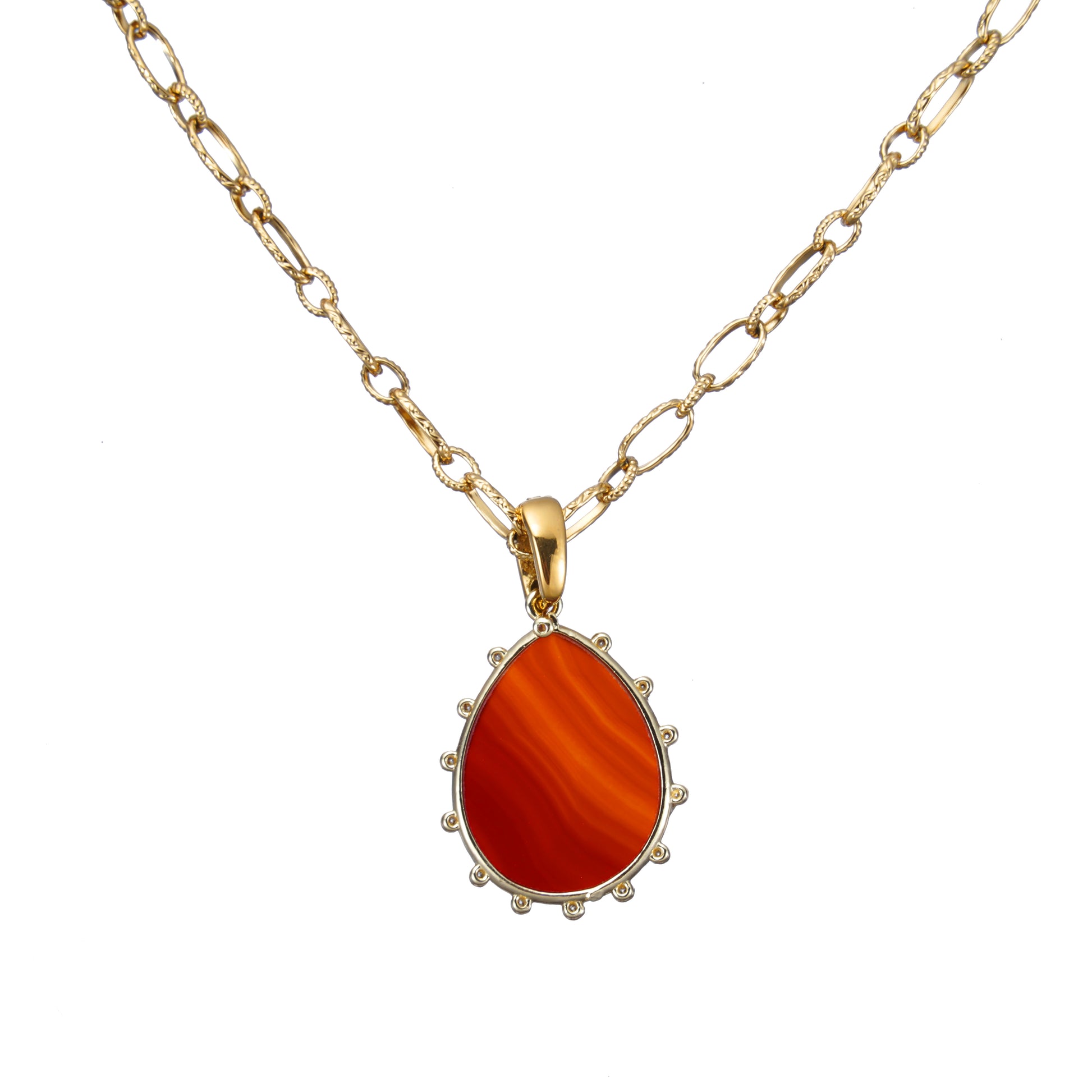 Gold necklace with a red Lapis Gemstone pendant on a white background