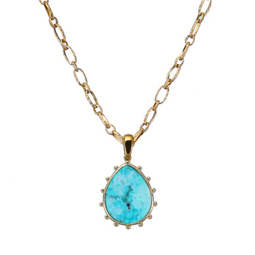 Gold necklace with a aqua Lapis Gemstone pendant on a white background