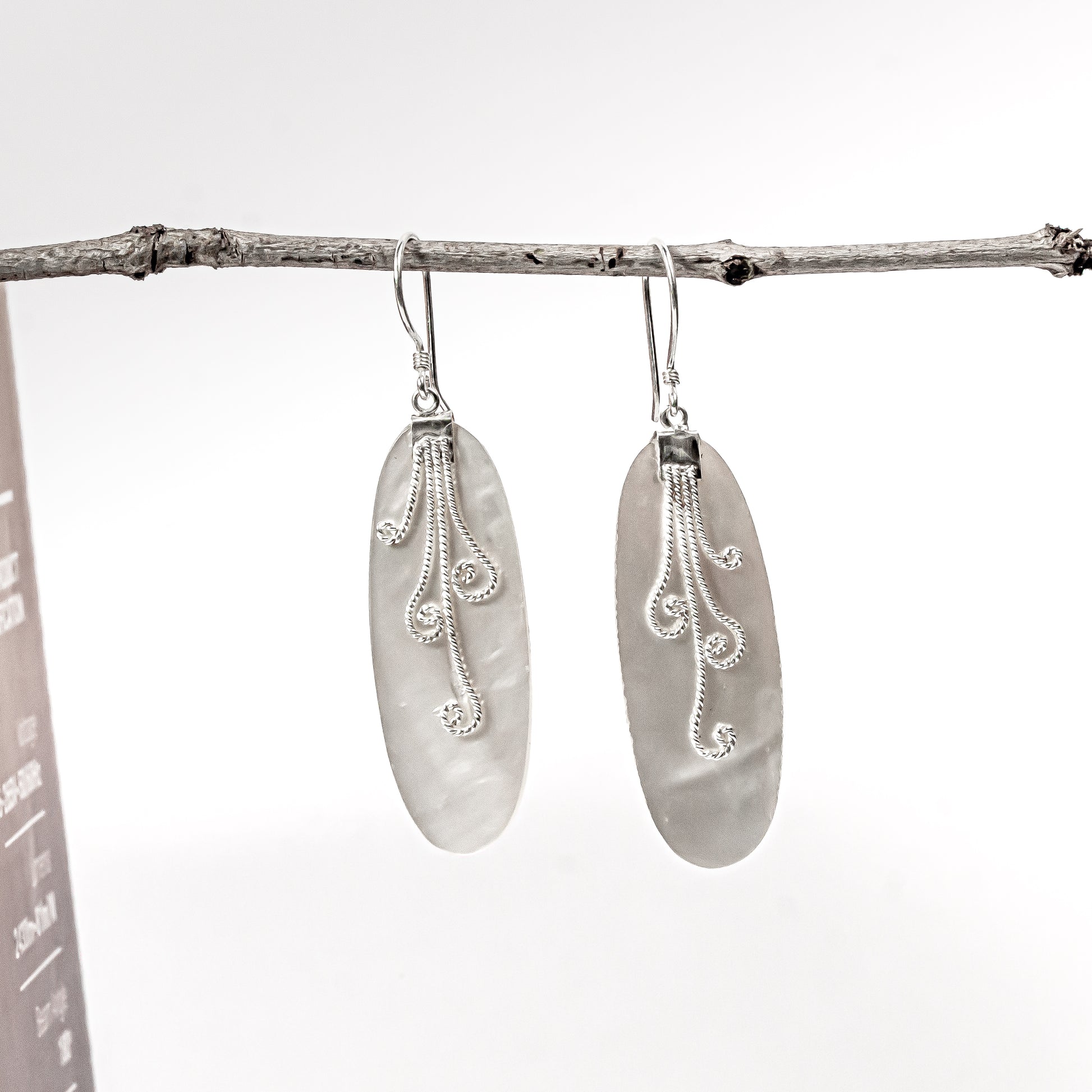 Elongated oval Mother of Pearl earrings with iridescent cream shell in a 925 sterling silver setting