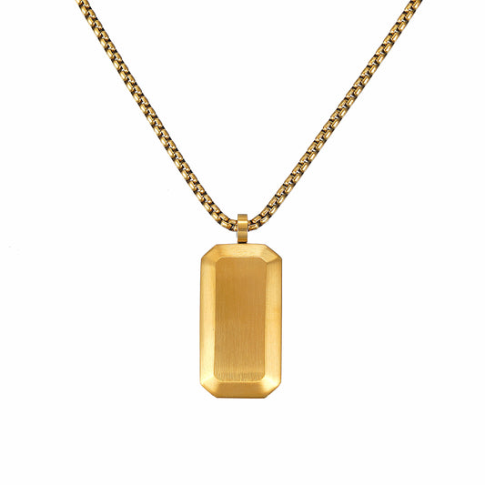 Gold rectangular Dog Tag pendant on a chain against a white background