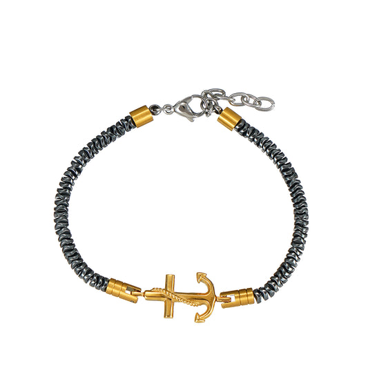 Bracelet with gold anchor charm and gray beads on a white background