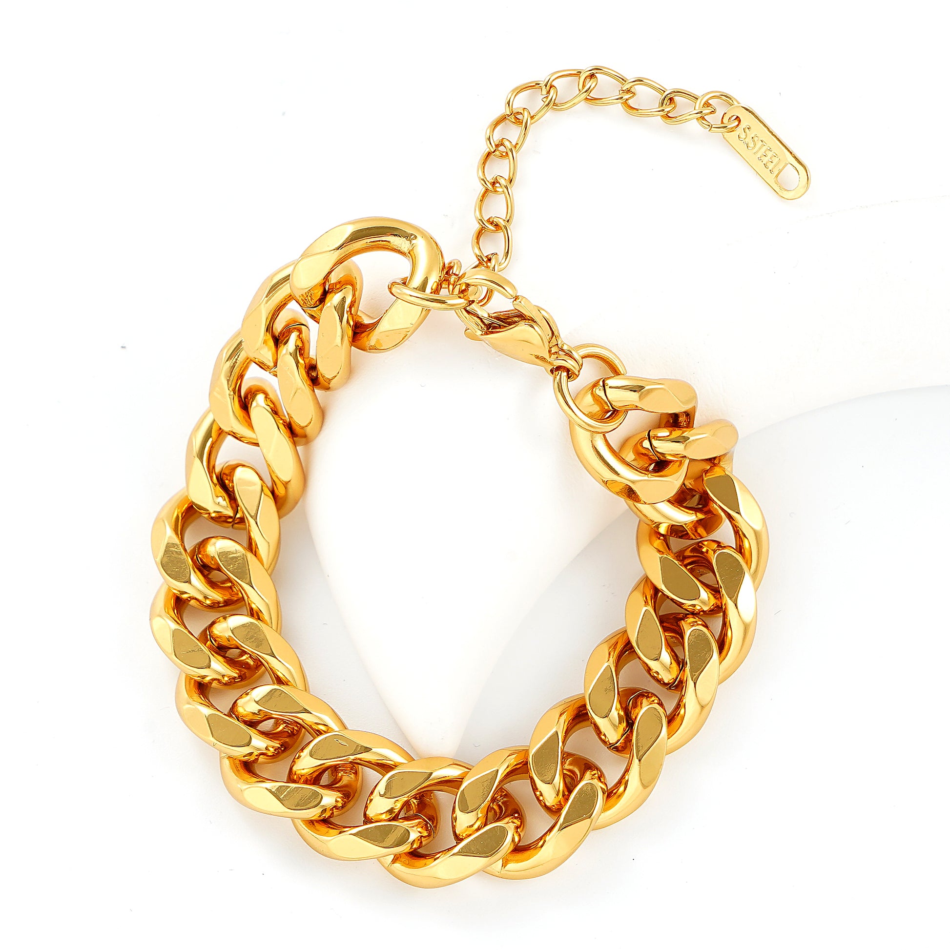 Gold chain bracelet on a white background