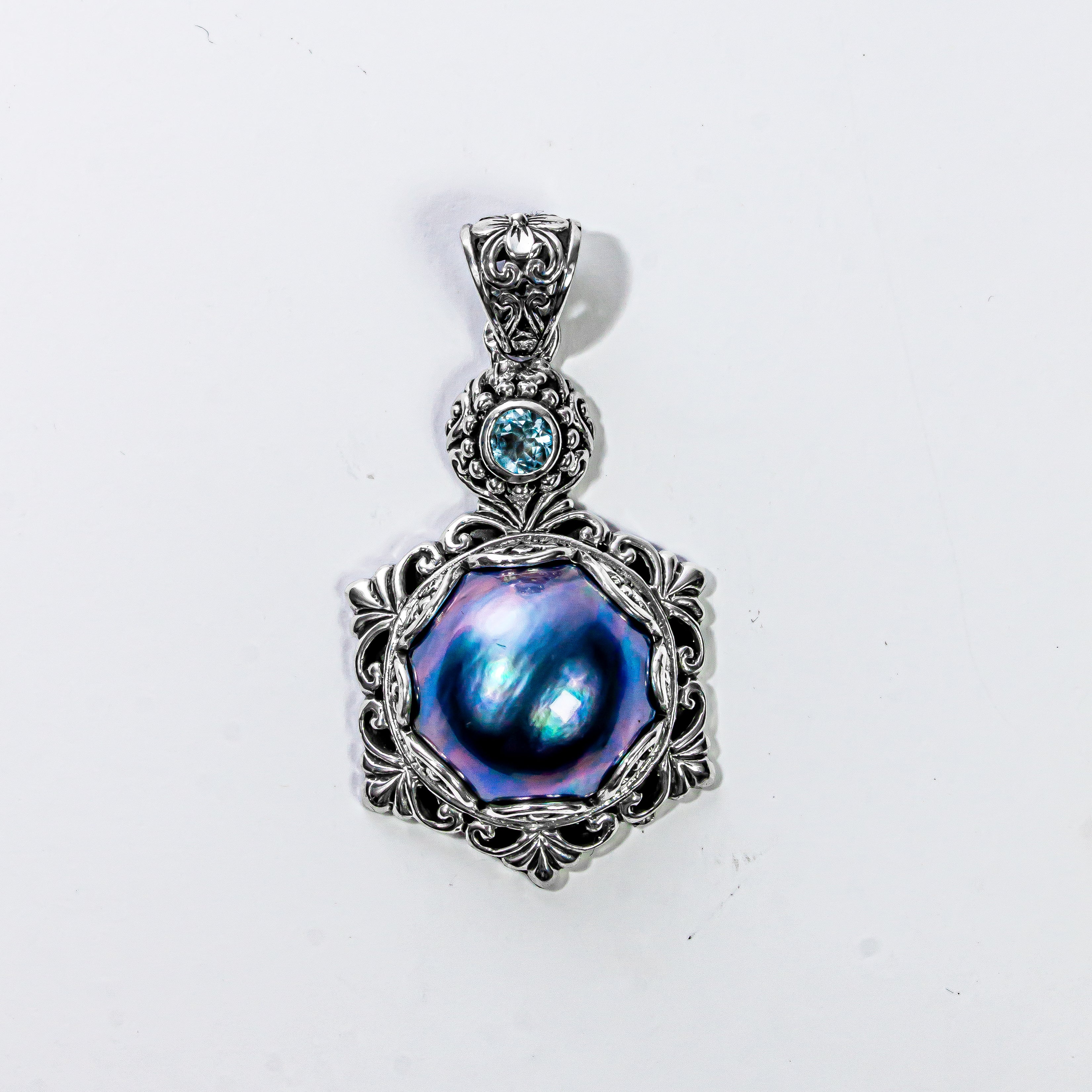 Enchanting Bali Handmade Peacock Mabe Pearl and Sky Blue Topaz pendant in Sterling Silver