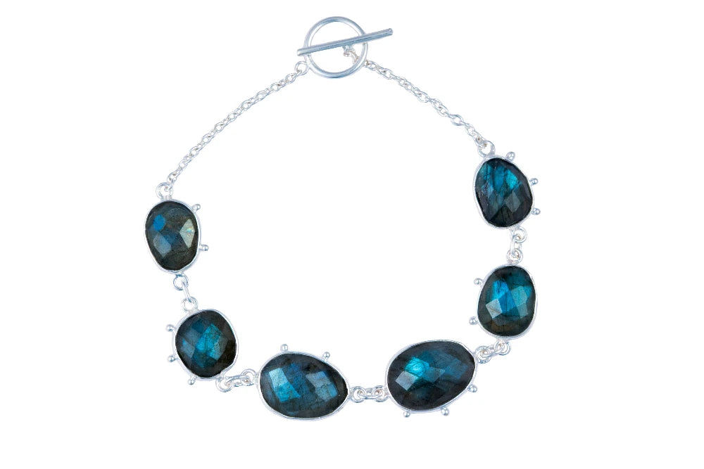 Silver bracelet with Labradorite gemstones on a white background