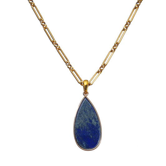 Gold necklace with a blue Lapis teardrop pendant on a white background