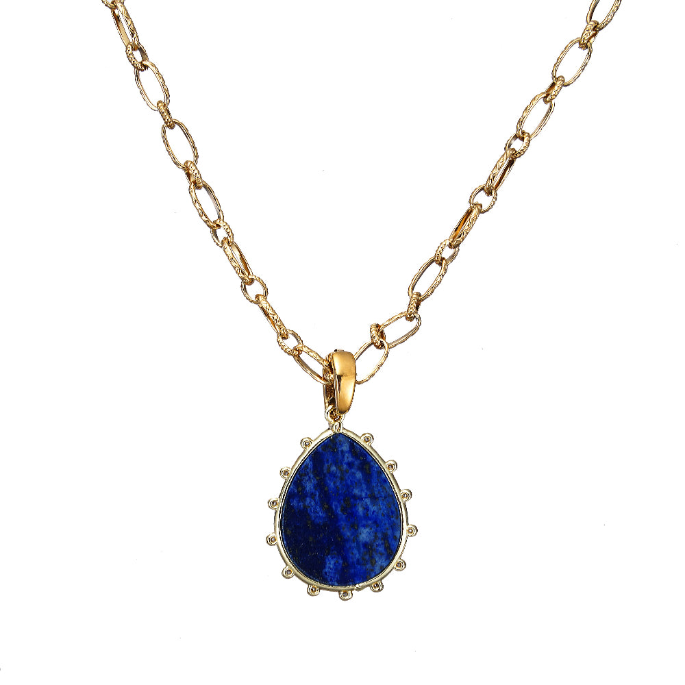 Gold necklace with a blue Lapis Gemstone pendant on a white background