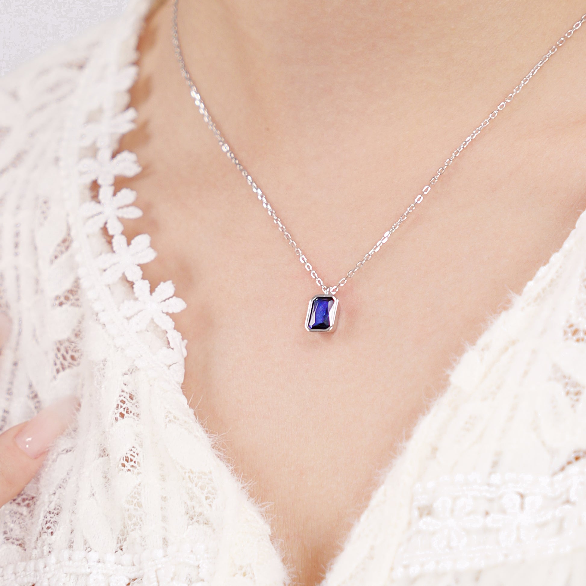 Octagon-cut clear CZ solitaire pendant in a polished silver bezel setting on a sterling silver chain