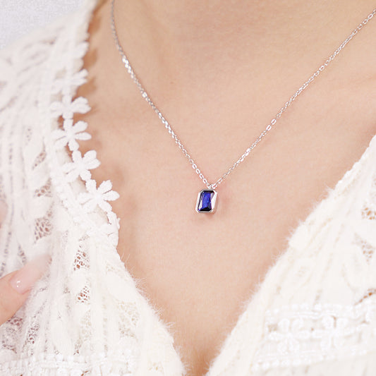 Octagon-cut clear CZ solitaire pendant in a polished silver bezel setting on a sterling silver chain