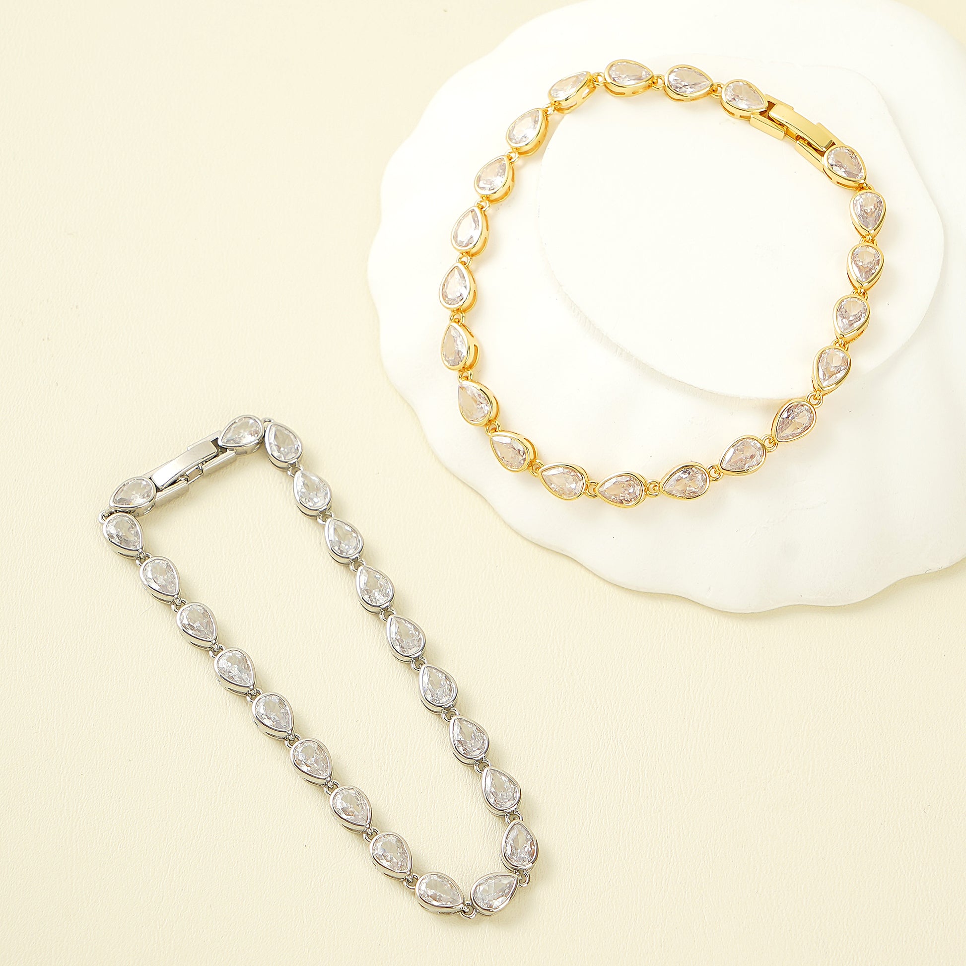 fancy pear-shaped simulated diamond stones on a gold-plated tennis bracelet