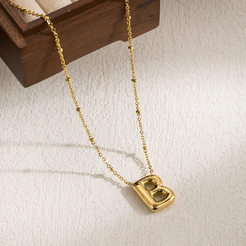 Polished 18K gold-plated "B" initial pendant on a durable stainless steel cable chain.