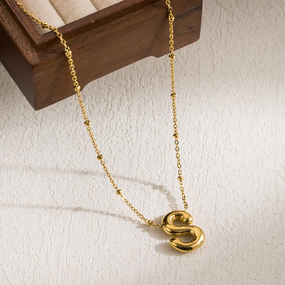  Polished 18K gold-plated "S" initial pendant on a stainless steel cable chain