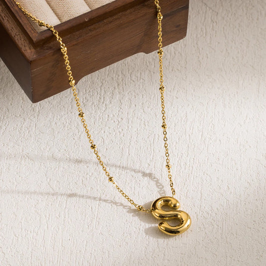  Polished 18K gold-plated "S" initial pendant on a stainless steel cable chain