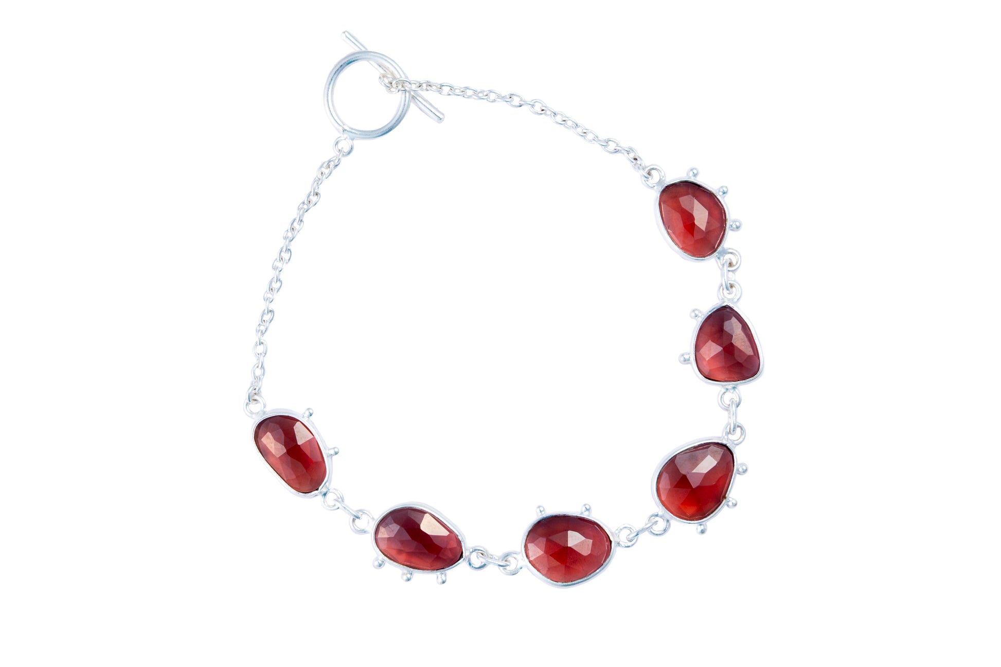 Bracelet with red teardrop-shaped gemstones on a white background