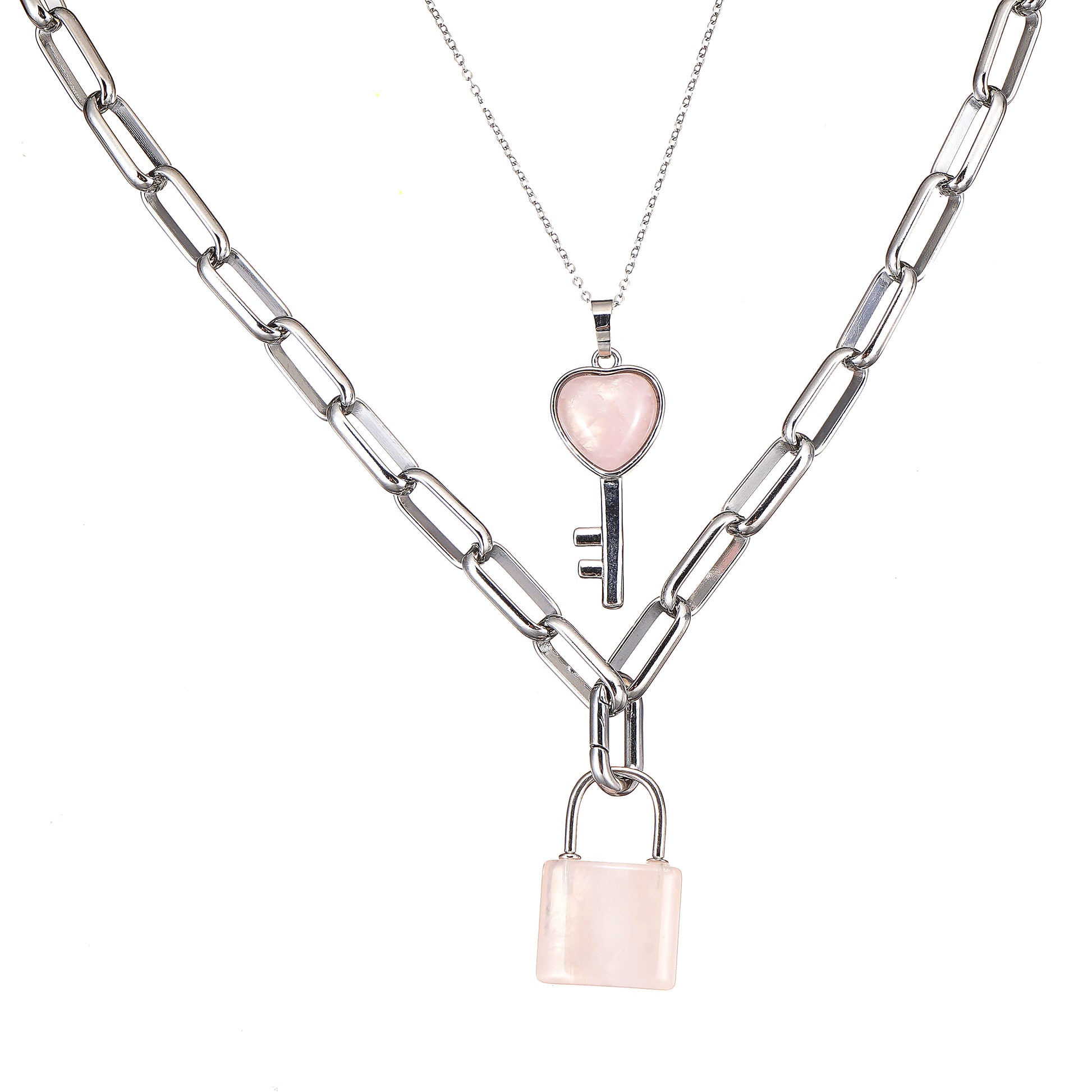 Two silver necklaces with Rose Quartz color heart and lock pendants on a white background