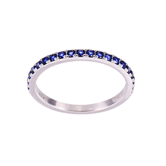 Silver ring with blue gemstones on a white background