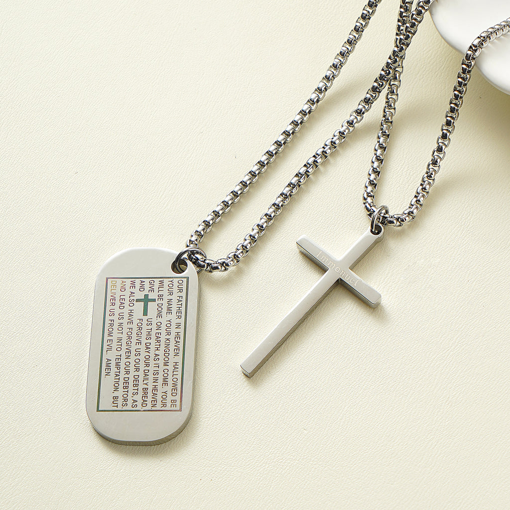 Stainless steel dog tag necklace engraved with the Lord's Prayer and a separate cross overlay.