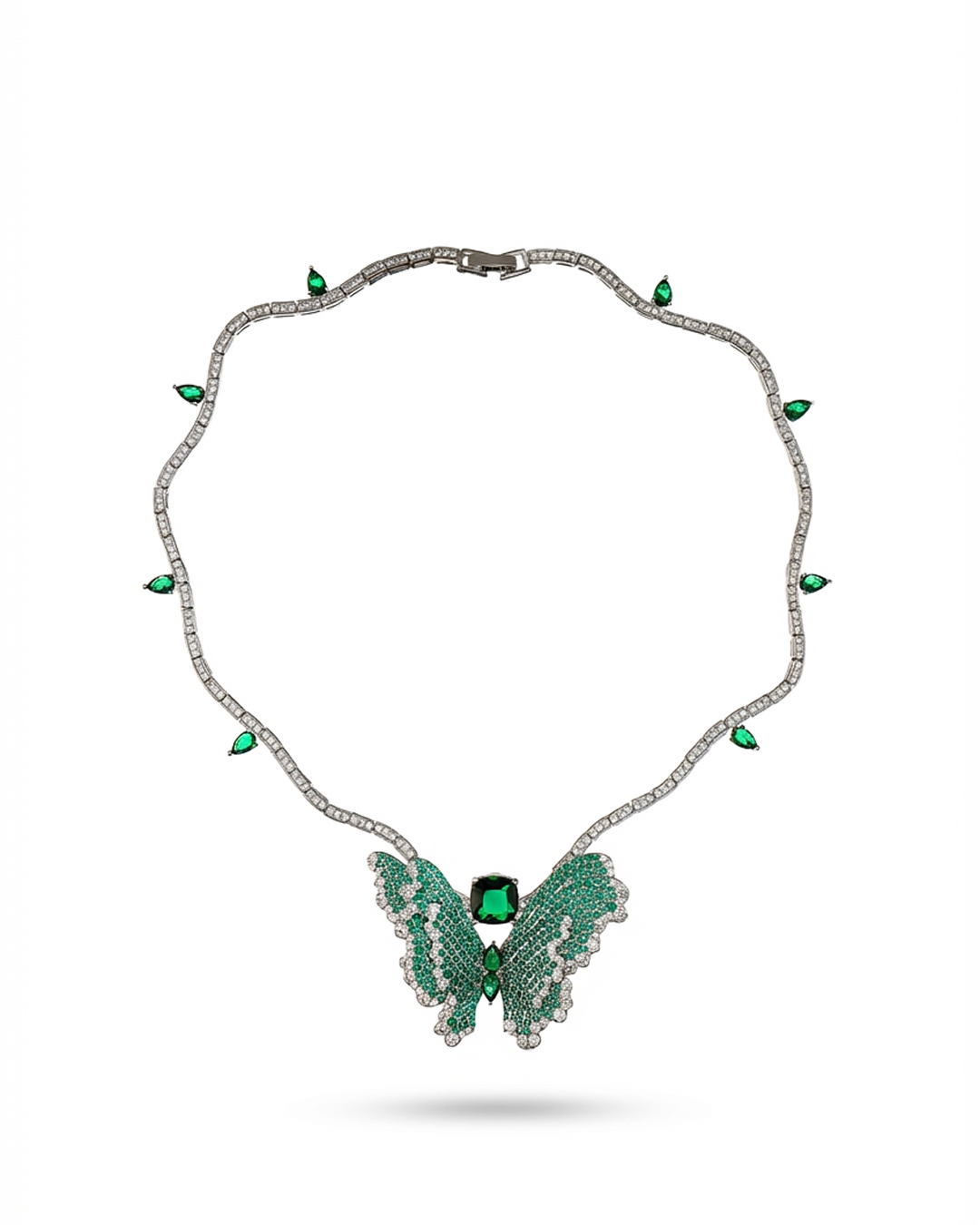 Butterfly-shaped necklace with green gemstones on a white background