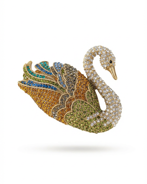Colorful swan-shaped brooch with gemstones on a white background