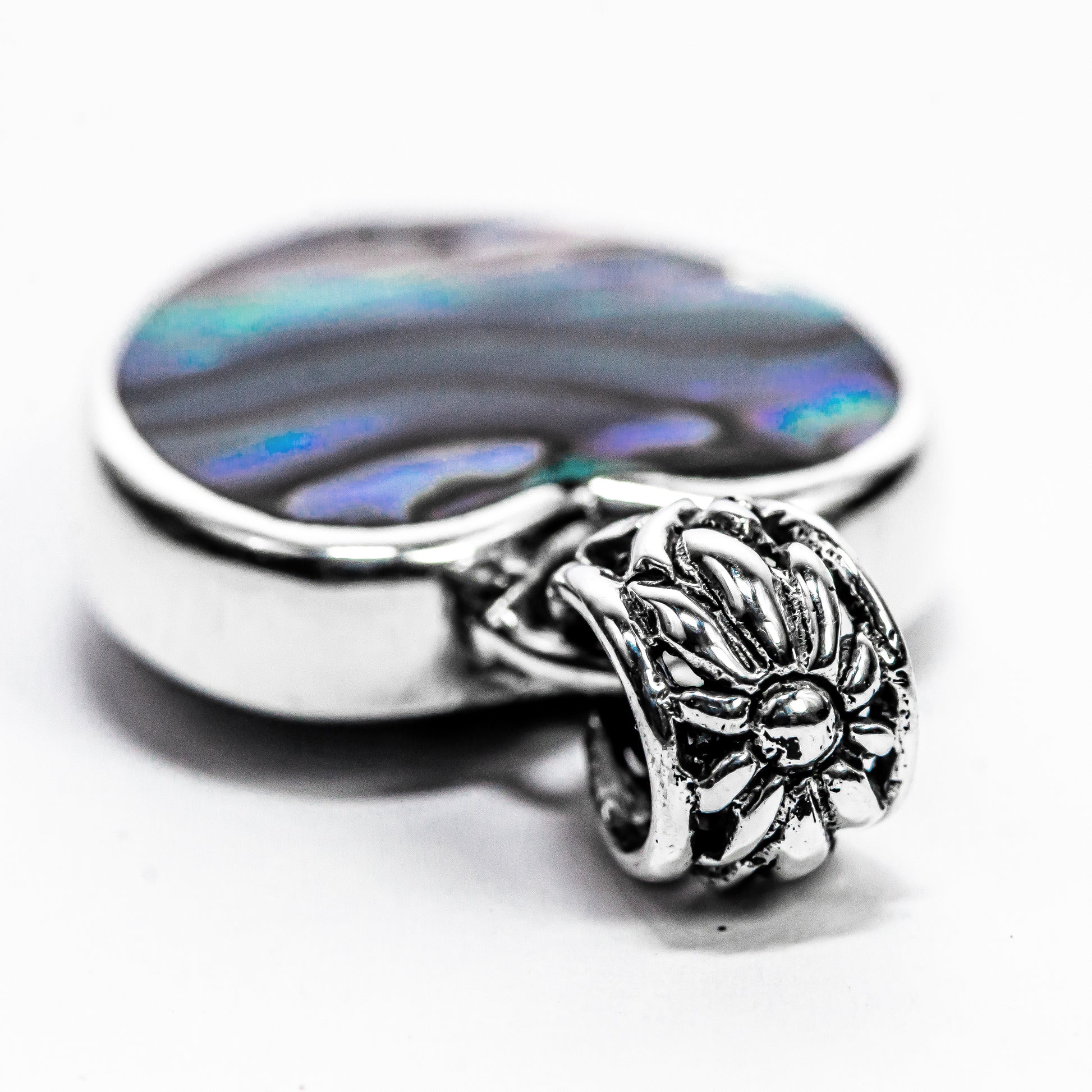 The polished reverse side of the handmade Bali heart pendant, demonstrating its two-in-one reversible design