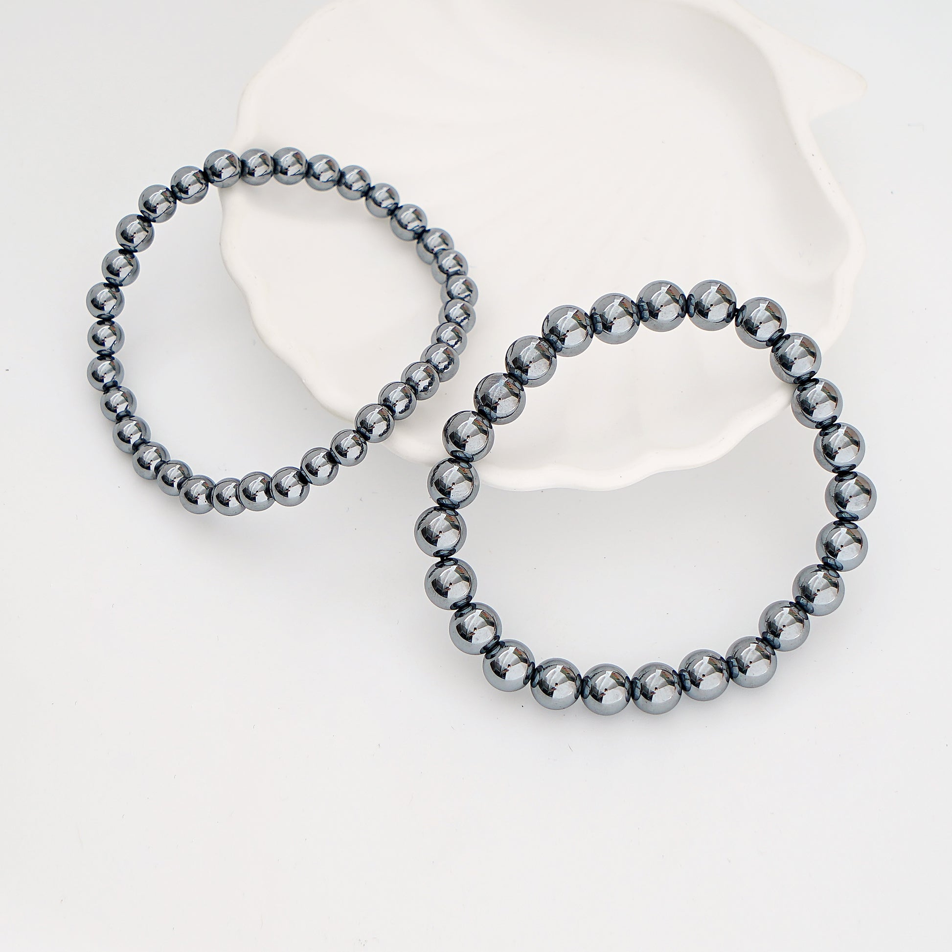 Two gray beaded bracelets 
