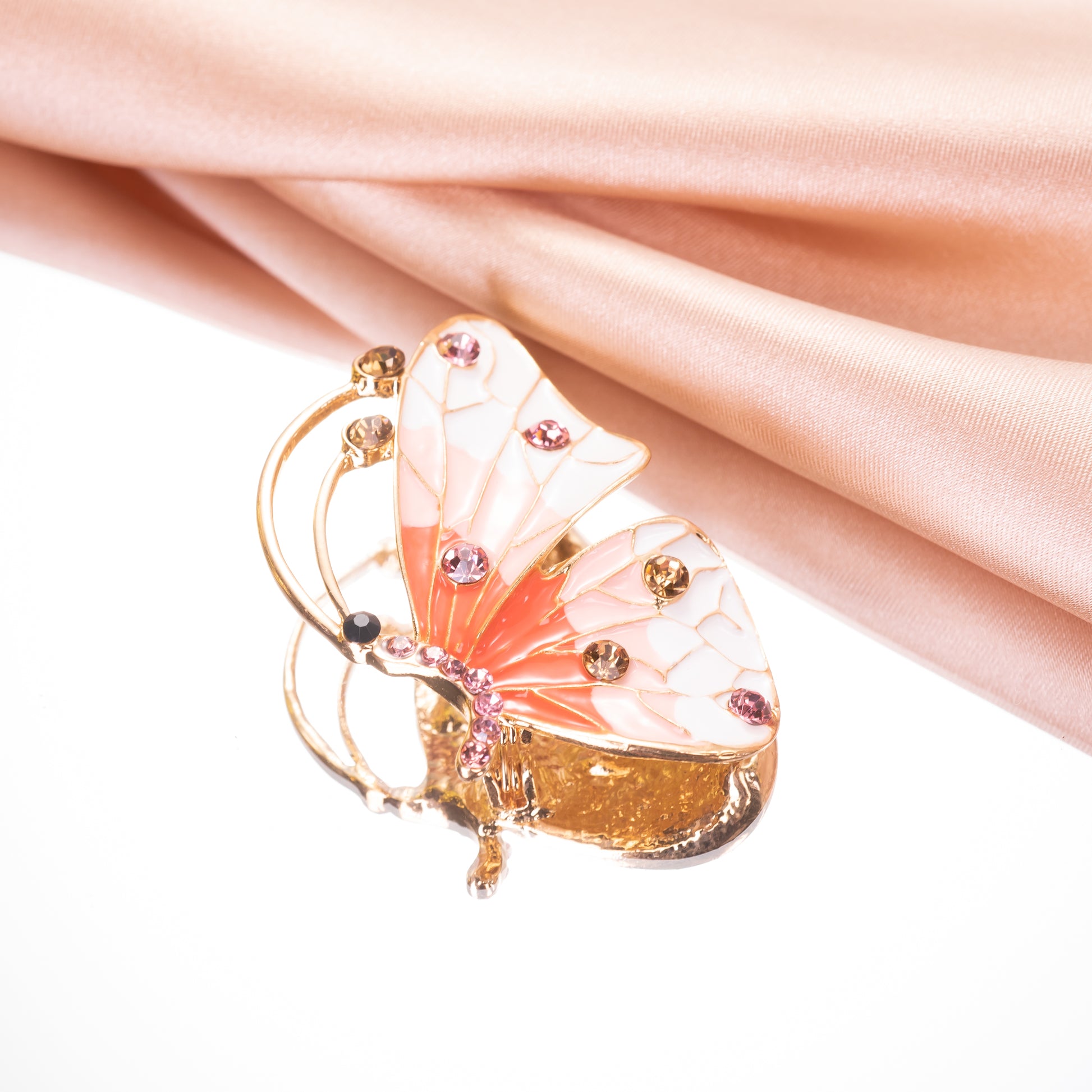 glossy colorful enamel wings on an antique-style butterfly pin